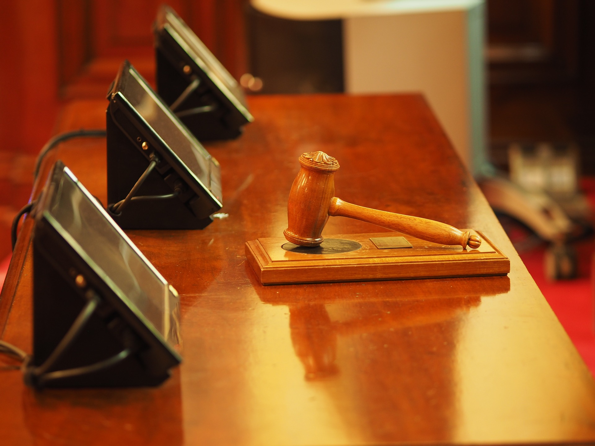 gavel and three tablets