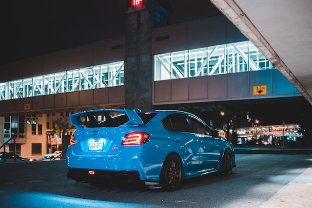 parked blue hatchback