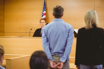 man in handcuffs in court room