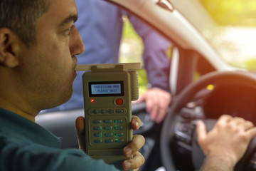 man doing breathalyzer