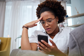 woman looking distressed at phone