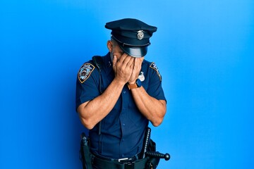 police officer with head in hands